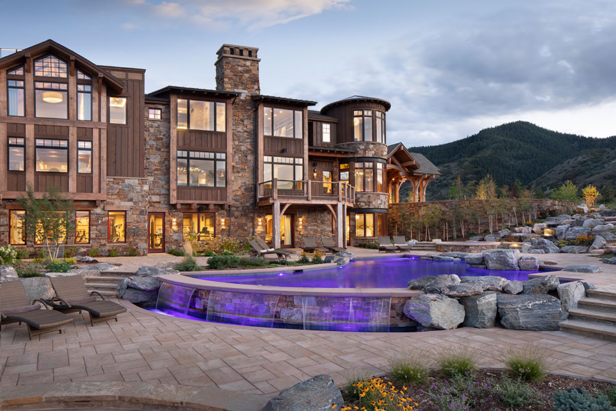 Beautiful stone lodge with lit up pool