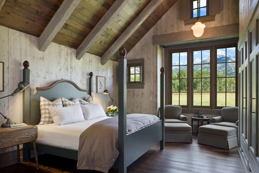 Master bedroom with light wood panel walls