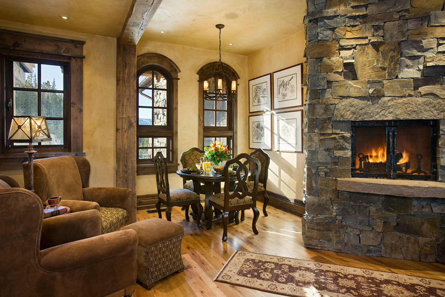 Small dining area with burning fireplace