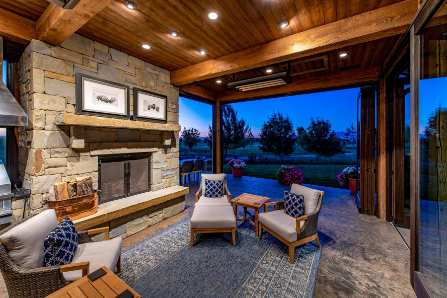 Outdoor living room fireplace in the evening