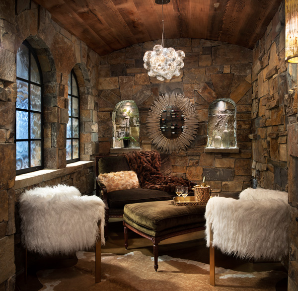 interior small living room fur seating stone mason walls