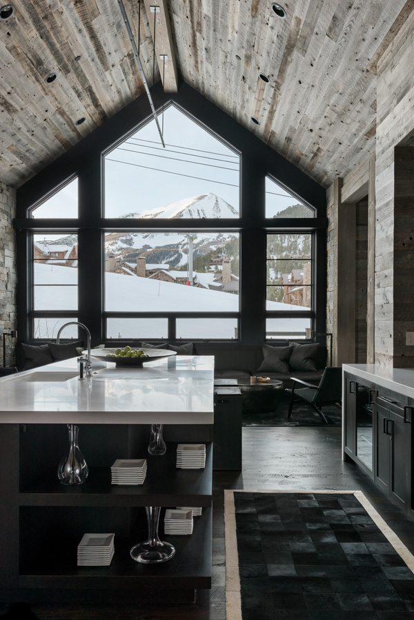 Interior kitchen counter with mountains framed in the window