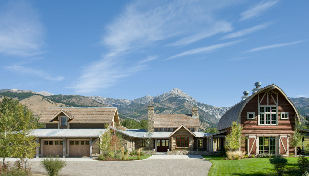 montana home builders exterior driveway and entry farm in front of mountain