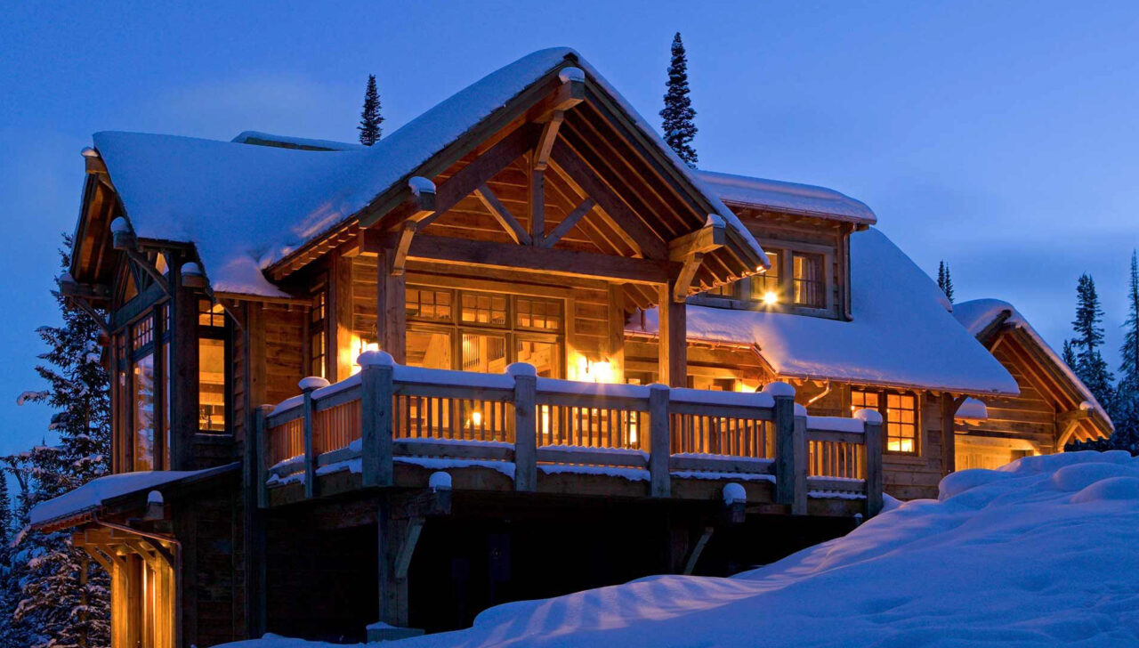 Cabin covered in snow.