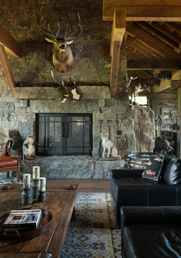 Oasis on Gallatin living room with deer mounted above fireplace